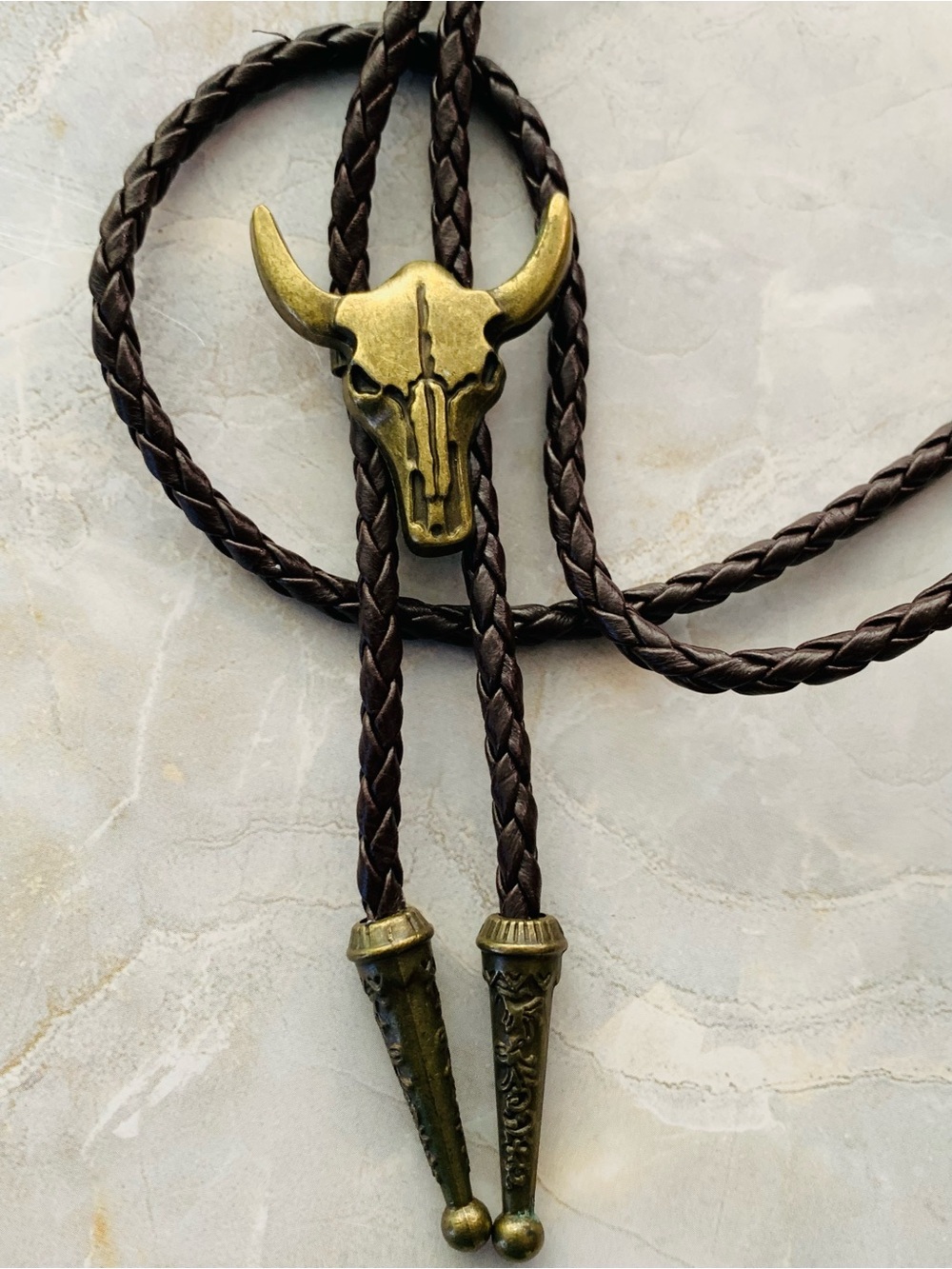 Western Bull Skull Bolo Tie in Brown Leather and Antique Brass